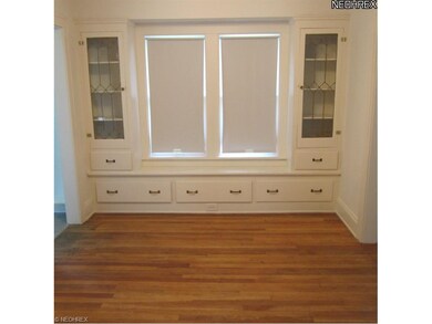 DINING ROOM HAS HARDWOOD FLOORING AND BUILT-INS