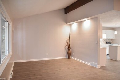 Spacious living room with vaulted ceilings and a w