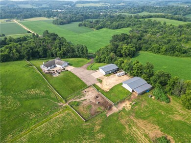 (2) 30' x 48 pole buildings included! Building on left has a concrete floor, power and 12' doors. Building on the right includes (4) box stalls with more possible, concrete, power, and newly added 18' x 48' lean to in 2020!
