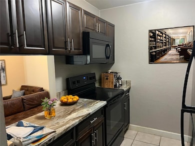 Kitchen with the service window Opens to DINING ROOM