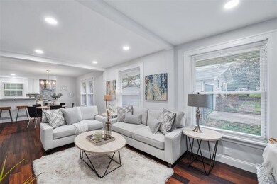 Living room has wood flooring, recessed lighting, 