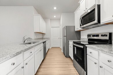 Whirlpool kitchen appliances and granite counterto