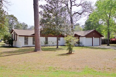 Side view of home with mature shady trees