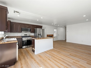 Kitchen featuring appliances with stainless steel