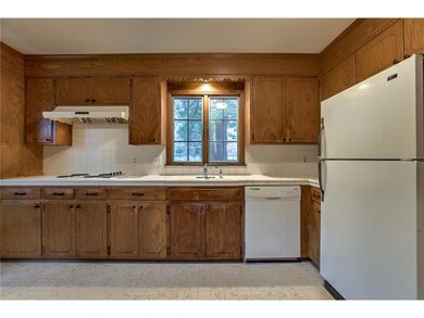 Kitchen with refrigerator and dishwasher.  All app