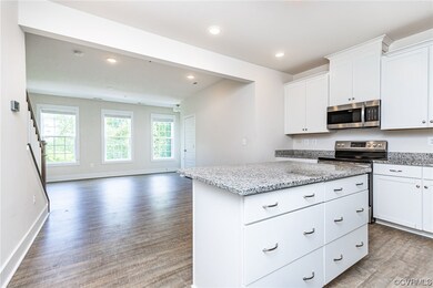 Kitchen featuring a healthy amount of sunlight, ra