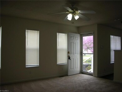 Living Room: Features include carpet flooring to help keep you warm and cozy, You have 3 windows for natural light and blinds for privacy, fresh paint and a ceiling fan with light. Here you can ss the front entry door, dining room is to the right side.