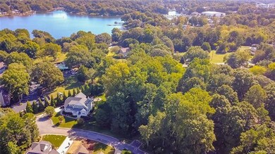 Lot 1 is located directly to the right of the hous