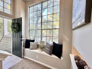 Dramatic foyer with high ceilings and big picture