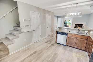 Kitchen featuring light wood-type flooring, a warm
