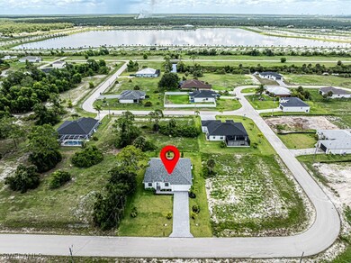 Aerial view of residential area with a large body