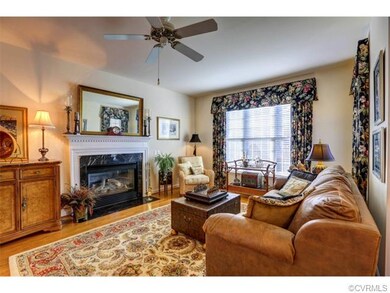 Hardwood Licing Room with Gas Fireplace and French