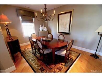 Formal dining room with chandelier and hardwood fl