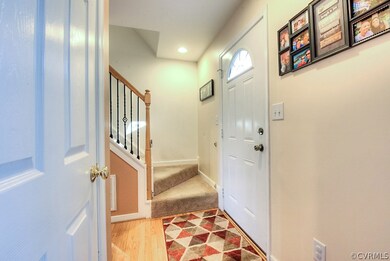 Foyer greets you with hardwood floors, stair acces