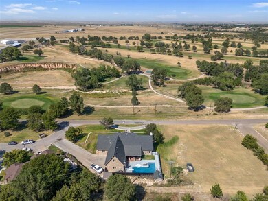 Birds eye view of property featuring a rural view