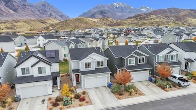 Aerial perspective of suburban area featuring a mountainous background