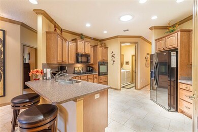 Nice appliances and plenty of maple cabinets!