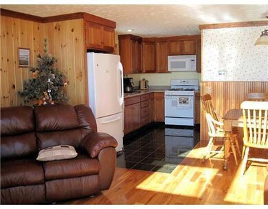 Kitchen. Granite and tile grace the...