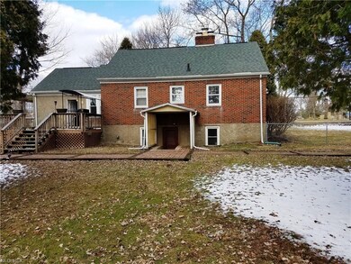 This cute brick Cape Cod is bigger than it looks a