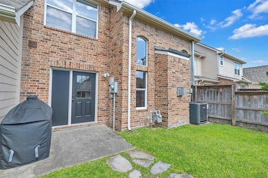 This photo shows a brick exterior of a two-story h