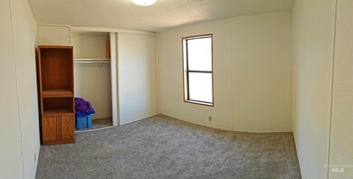 Unfurnished bedroom featuring carpet flooring, a closet, and a textured ceiling