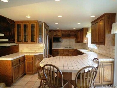 Beautiful oak cabinets with lots of storage and co