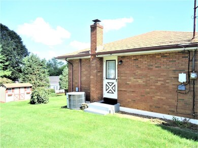 Side view with central air conditioner