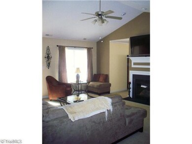Living Room. Large Living Room with built-in shelving, updated ceiling fan, well cared for carpeting, and gas log fireplace!  This home is move in ready for you!