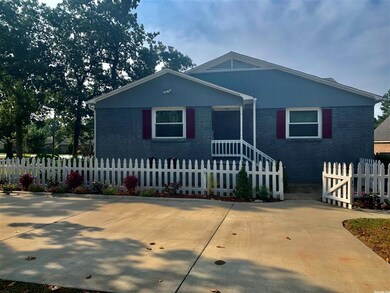 1 level brick cottage with paved parking