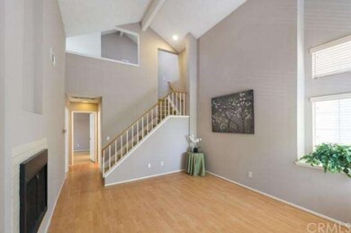 Living room offers high ceiling and hardwoor floor