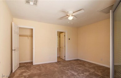 Unfurnished bedroom featuring carpet and baseboard