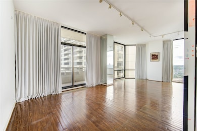 Soaring floor-to-ceiling windows pair perfectly wi