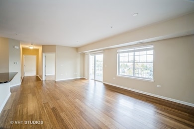 Living and dining area filled with natural light f