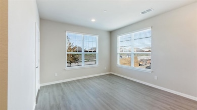 Unfurnished room with light wood-style floors and recessed lighting