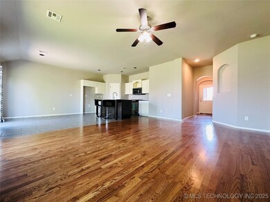 Unfurnished living room with wood finished floors,