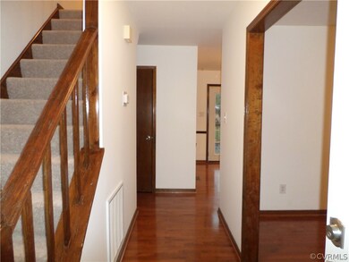 Beautiful entranceway with gleaming hardwood floor
