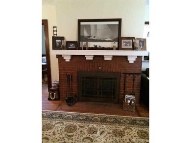 Living Room charming wood burning fireplace