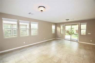 Unfurnished room with baseboards and light tile pa