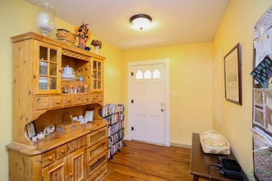 Entrance foyer featuring wood finished floors