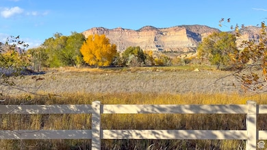 View of mountain background featuring rural landscape