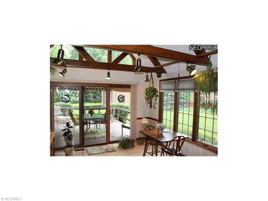 This is a sunroom off the kitchen and rear of the 