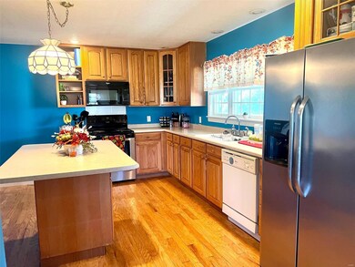 Kitchen with center island and bar seating.