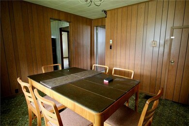 Dining Room showing door to basement and entryway 