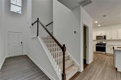 Stairway with hardwood / wood-style flooring