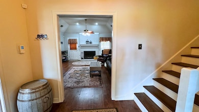 Corridor with dark hardwood / wood-style flooring 
