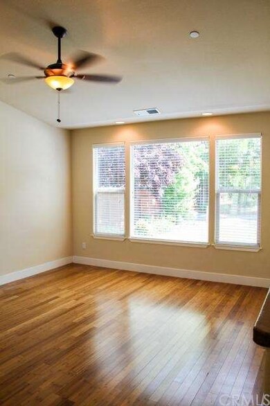 Living room features a wall of windows to the fron