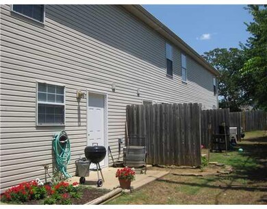 Exterior Back. Back door access to each unit has privacy fence separator