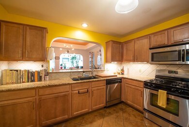 Kitchen featuring appliances with stainless steel