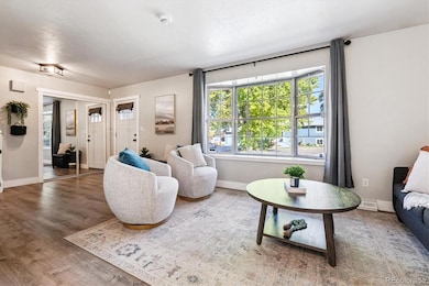 Inviting entry opens to a bright living room with vaulted ceilings and warm natural light
