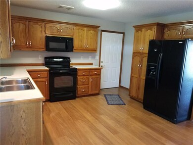 Kitchen with deep sinks, lots of cabinets, pull ou